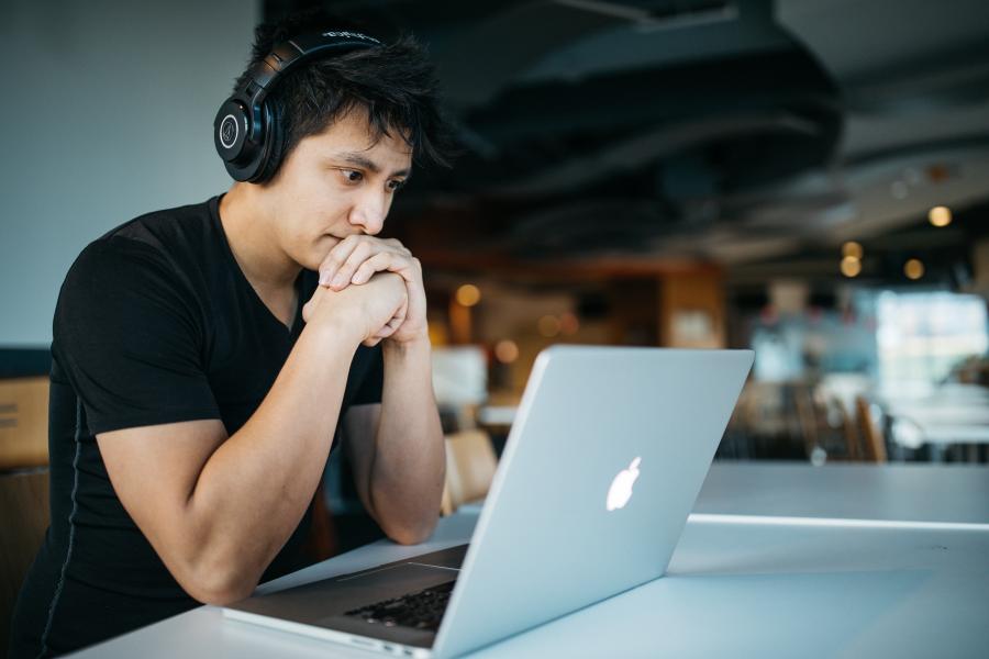 male student working on laptop